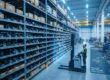 A modern industrial warehouse with high shelves containing mechanical spare parts, overlaid with a clean digital interface showing schematics and data visualizations, bright blue and white lighting, professional and technical atmosphere, 8k quality, photorealistic